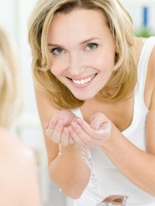 woman using face wash for sensitive skin